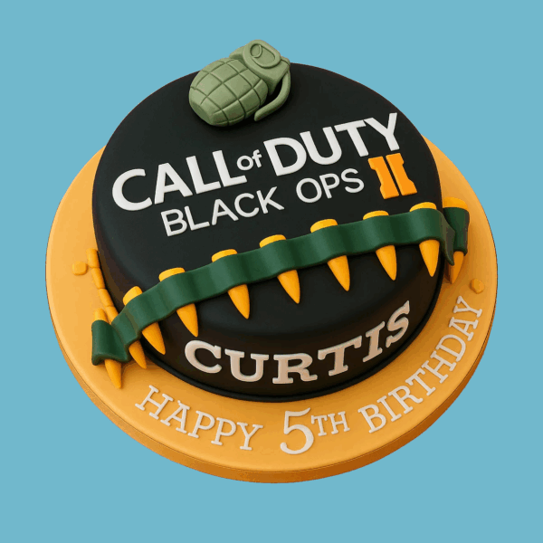 A round cake decorated with the Call of Duty: Black Ops logo prominently displayed on top. The cake features a detailed edible grenade and a bandolier of ammunition wrapped around its side, creating an adventurous and authentic gaming theme. The design uses bold colors and sharp details to capture the spirit of the game. The cake can be personalized with a name and message on the base, is available in multiple sizes and flavors, and serves as a striking centerpiece for gamer-themed celebrations.