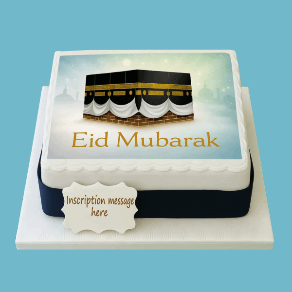 Eid Celebration Cake covered in smooth white fondant, featuring a detailed edible image of the Kaaba at the center. The cake is decorated with star accents, a dark ribbon around the base, and a personalized message plaque on top, combining elegance and meaningful symbolism for Eid celebrations.
