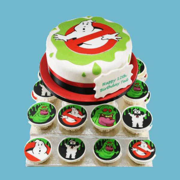 Ghostbusters-themed cupcake tower featuring a central round cake with the Ghostbusters logo and green slime details, surrounded by cupcakes decorated with edible images of Ghostbusters characters, equipment, and symbols. Includes a personalised message plaque.