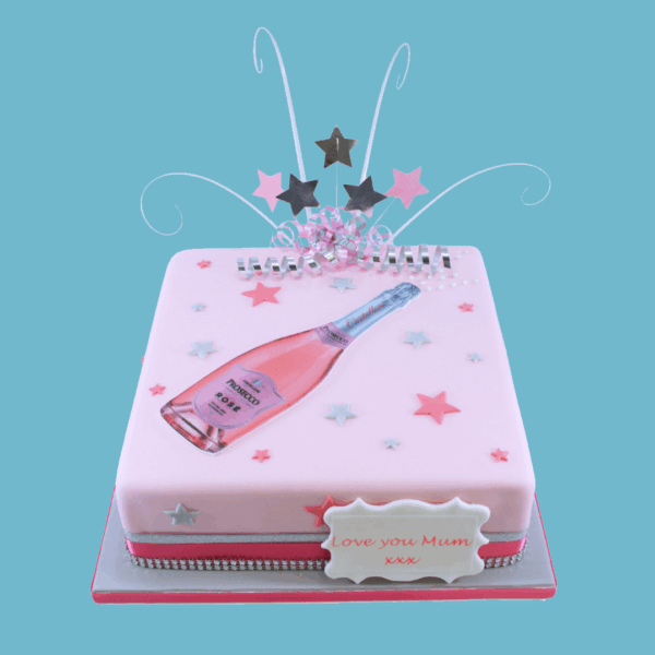 A square Pink Prosecco Rosé-themed cake featuring an image of a pink prosecco bottle on top, surrounded by a stylish pink colour scheme. Decorative star toppers add a festive touch, while a personalised message plaque sits at the front for custom greetings. The cake combines elegance and celebration, making it ideal for birthdays, anniversaries, or stylish gatherings. Its smooth finish and modern design create a sophisticated centrepiece that appeals to prosecco lovers and party guests alike.