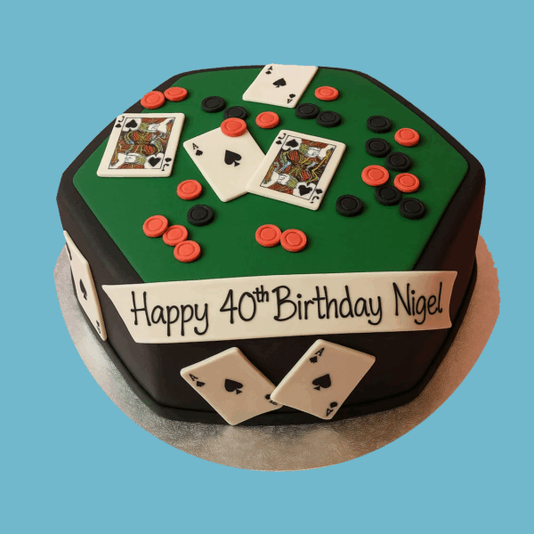 A novelty cake designed to look like a classic poker table with a vibrant green playing surface. The cake features fondant decorations including playing cards arranged as if mid-game, stacks of red and black poker chips, and small green dice. A sleek black trim surrounds the table edge, completing the realistic casino look. This cake is an eye-catching centerpiece perfect for poker fans and casino-themed celebrations