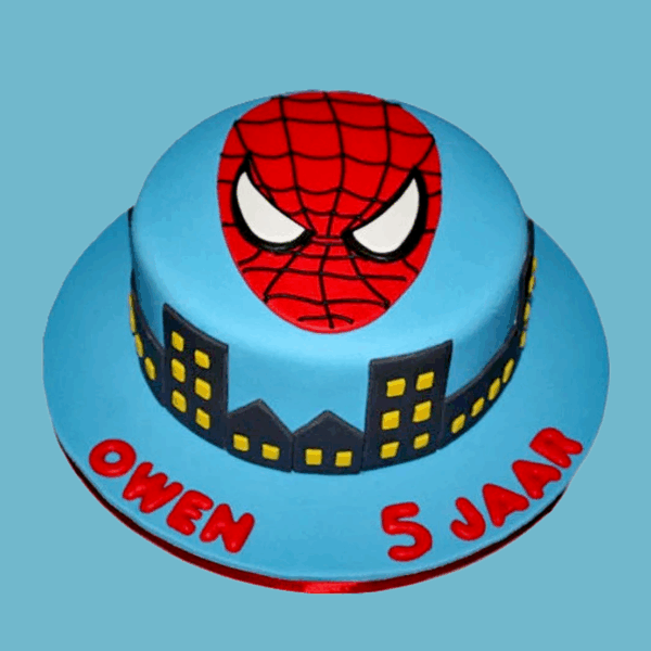 A round cake with a vivid blue base featuring a black city skyline silhouette wrapped around the sides, detailed with yellow painted windows to create a glowing night effect. On top sits a bright red Spider-Man mask with crisp white eyes outlined in black, serving as the cake’s focal point. The design captures the energy of Spider-Man and a bustling cityscape, making it a striking centerpiece for superhero-themed celebrations.