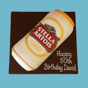 A realistic Stella Artois Can Cake designed to replicate a Stella Artois lager can, featuring the brand’s red, gold, and white colours with the iconic logo accurately placed on the front. The cake includes a metallic-style finish and an edible pull-tab on top for added realism. It sits on a dark brown base that enhances the can’s bold appearance, making it a standout centrepiece for birthdays, retirements, or beer-themed celebrations.