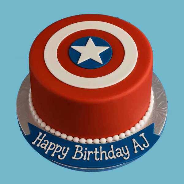 A round cake decorated with a classic superhero shield design featuring concentric red and white circles around a vibrant blue center with a crisp white star in the middle. A smooth blue fondant banner wraps around the base, ready for a personalized message. The cake is brightly colored and visually striking, perfect for superhero-themed celebrations.