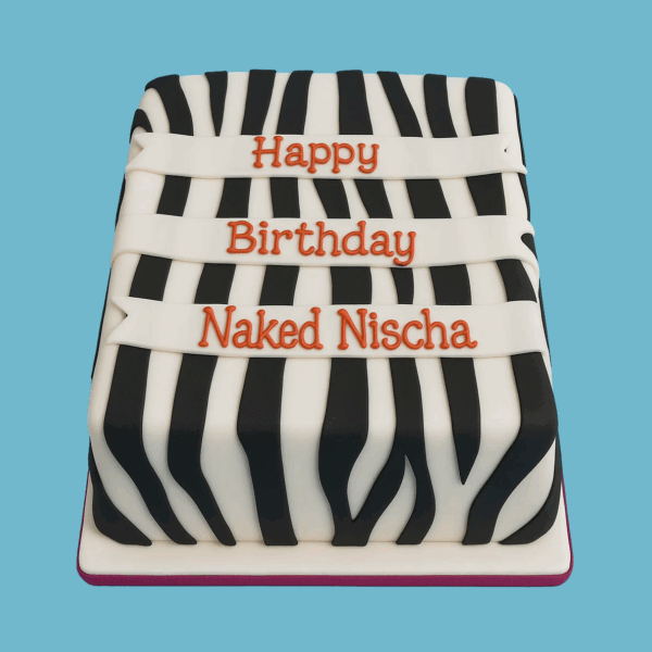 A rectangular cake decorated with bold black and white zebra stripes covering the entire surface and visible through the layered interior. The striking pattern resembles a zebra’s coat, creating a dramatic and elegant look. The cake is smooth and polished, ready for special occasions, with customizable sizes, flavors, frostings, and decorations to suit any event.