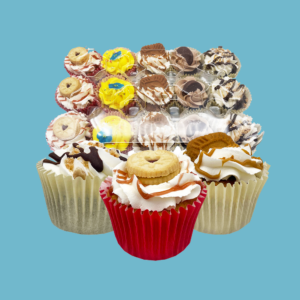 A vibrant box containing 15 Funky Cupcakes, each uniquely decorated with bold, colorful frostings, playful sprinkles, crunchy biscuits, and rich chocolate drizzles. The cupcakes are neatly arranged in individual cases within a clear tray, showcasing a variety of creative designs and textures. Perfect for parties and gatherings, this assortment offers a mix of classic and innovative flavors, providing a fun and flavorful centerpiece for any celebration.